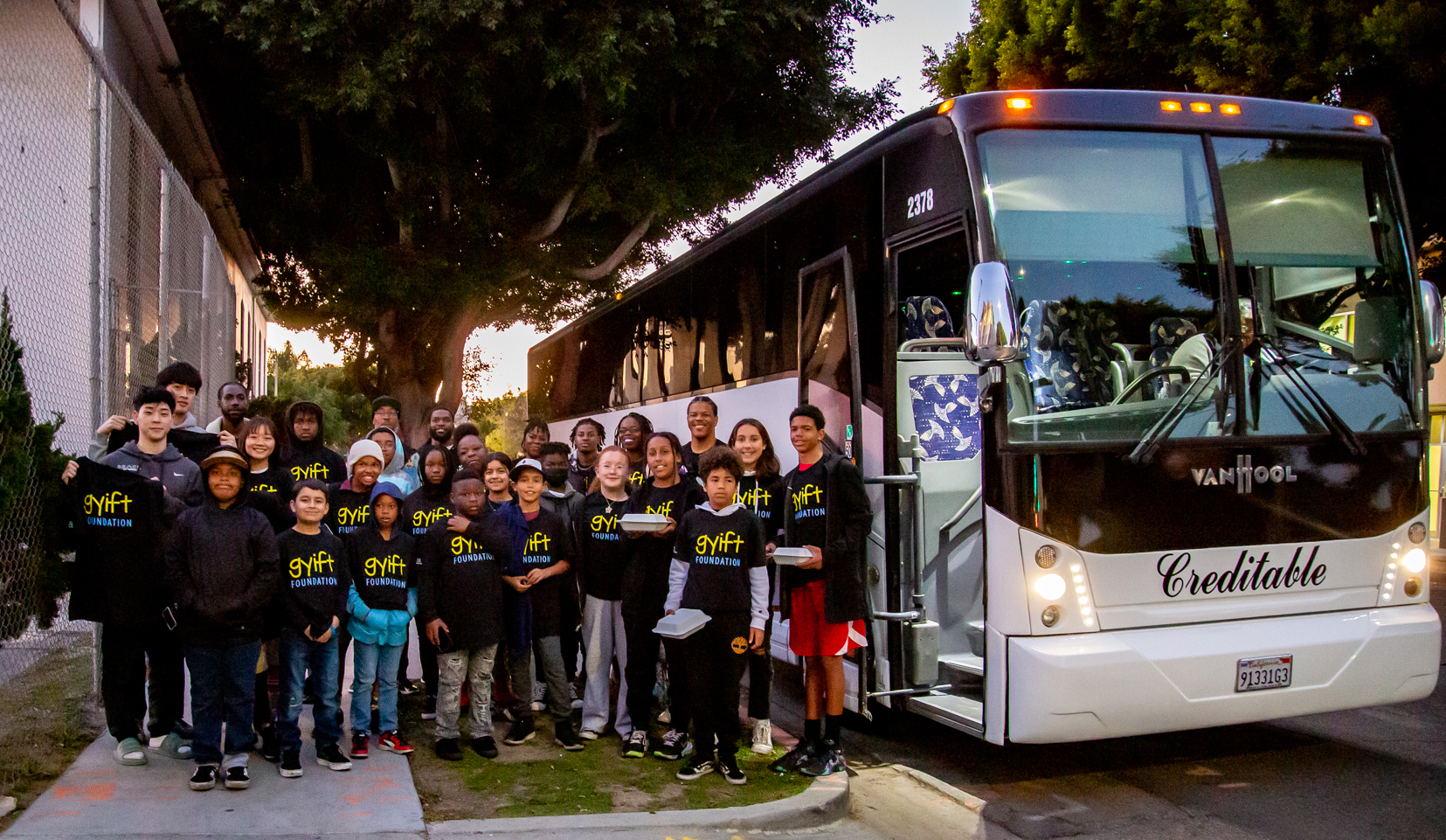 Through the GYIFT Vusaini Initiative a group of disadvantaged children were able to attend a Los Angeles Clippers versus Dallas Mavericks basketball game. This is a photo of the children as they were boarding the buss to the Staples Center.