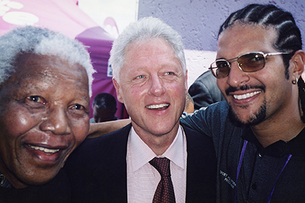 From left to right: Nelson Mandela, President Bill Clinton, and Myke Scholl